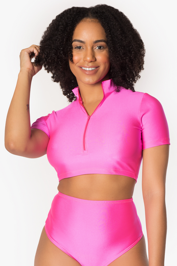 Top corto con cremallera de color rosa neón